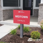 Model Home Sign Displaying Name and Square Footage in a New Home Community.